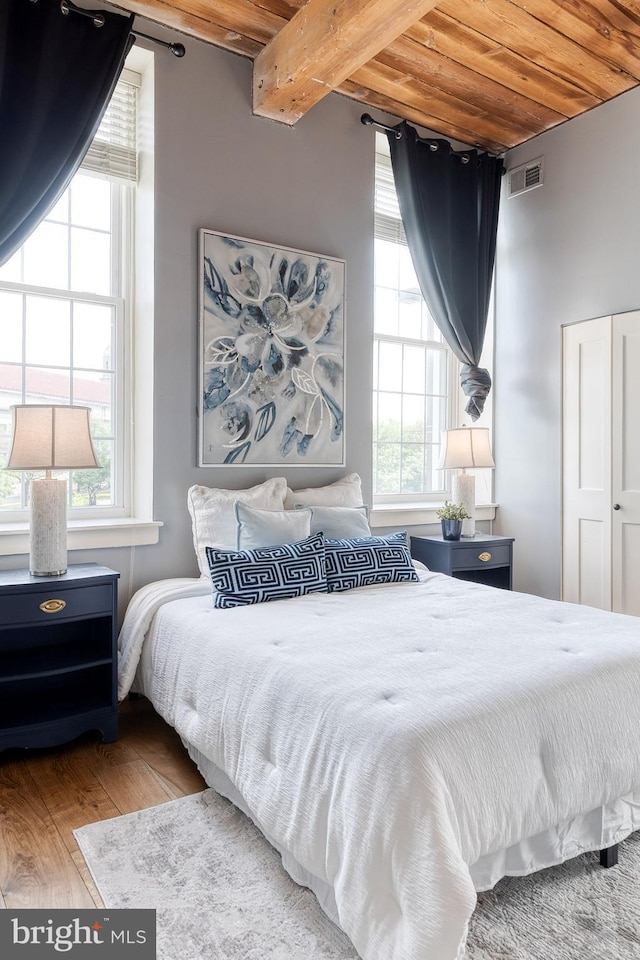 2639 Boston St Unit 203, Baltimore, MD 21224 - bedroom with visible vents, beamed ceiling, multiple windows, and wood ceiling