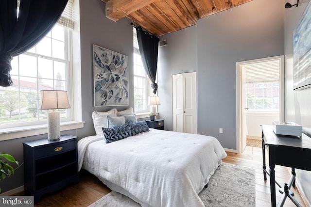 2639 Boston St Unit 203, Baltimore, MD 21224 - bedroom featuring wooden ceiling, wood finished floors, and multiple windows