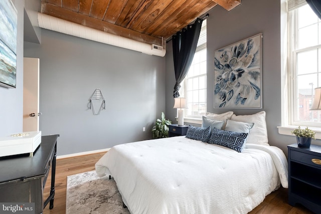 2639 Boston St Unit 203, Baltimore, MD 21224 - bedroom with visible vents, wood finished floors, multiple windows, and wood ceiling