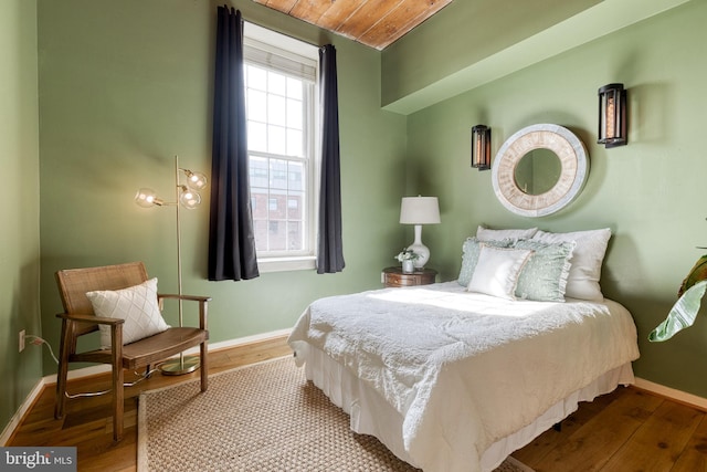 2639 Boston St Unit 203, Baltimore, MD 21224 - bedroom with wooden ceiling, wood finished floors, and baseboards