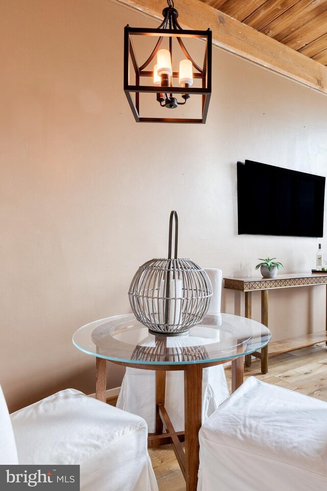 2639 Boston St Unit 203, Baltimore, MD 21224 - dining area featuring wood finished floors and a notable chandelier