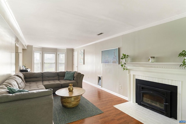 1720 Franklin Dr, Charlottesville, VA 22911 - living area featuring crown molding, wood finished floors, a fireplace, baseboards, and visible vents