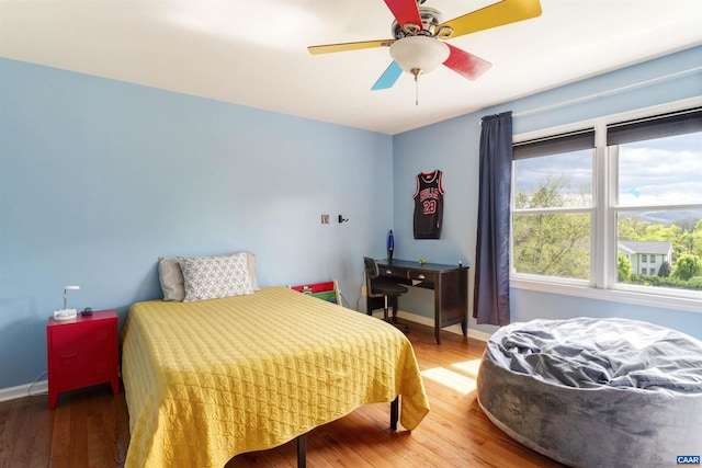 1720 Franklin Dr, Charlottesville, VA 22911 - bedroom with wood finished floors, a ceiling fan, and baseboards