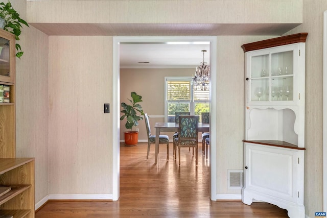 1720 Franklin Dr, Charlottesville, VA 22911 - dining room with wood finished floors, visible vents, baseboards, and a notable chandelier