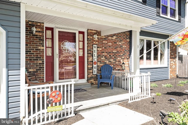 3 David Dr, Ewing, NJ 08638 - doorway to property featuring brick siding and a porch