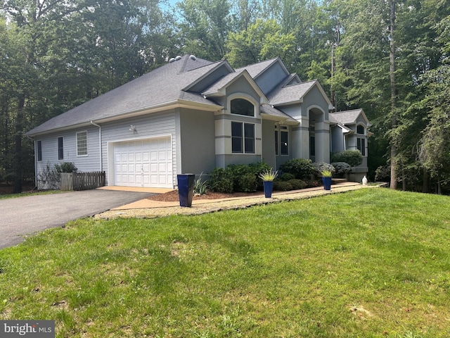 14500 River Junction Dr, Fredericksburg, VA 22407 - ranch-style house featuring driveway, a garage, a front yard, and stucco siding