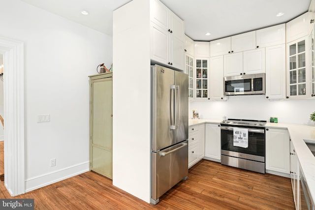 20-22 W Harvey St, Philadelphia, PA 19144 - kitchen featuring stainless steel appliances, wood finished floors, white cabinetry, light countertops, and recessed lighting