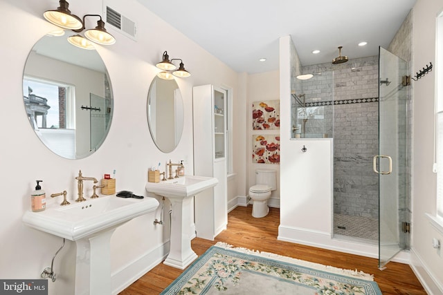 20-22 W Harvey St, Philadelphia, PA 19144 - full bathroom with a stall shower, wood finished floors, toilet, recessed lighting, and baseboards
