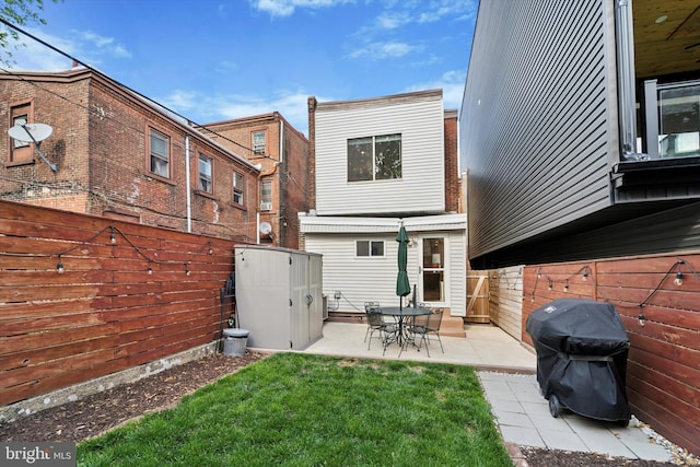 rear view of property featuring a patio