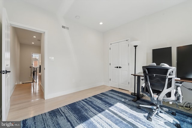 office area with wood finished floors, recessed lighting, and baseboards