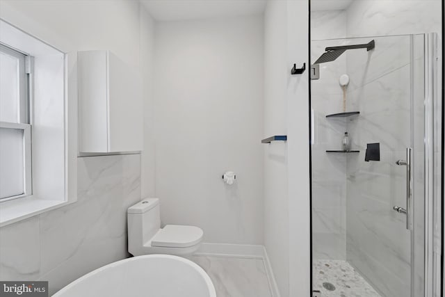 full bathroom featuring a marble finish shower, toilet, marble finish floors, and baseboards