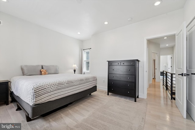 bedroom featuring light wood-style flooring, recessed lighting, and baseboards