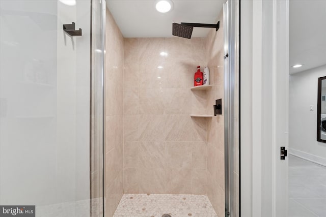 bathroom featuring a stall shower, tile patterned flooring, and recessed lighting