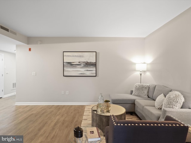 350 G St SW Unit N407, Washington, DC 20024 - living area with visible vents, baseboards, and wood finished floors