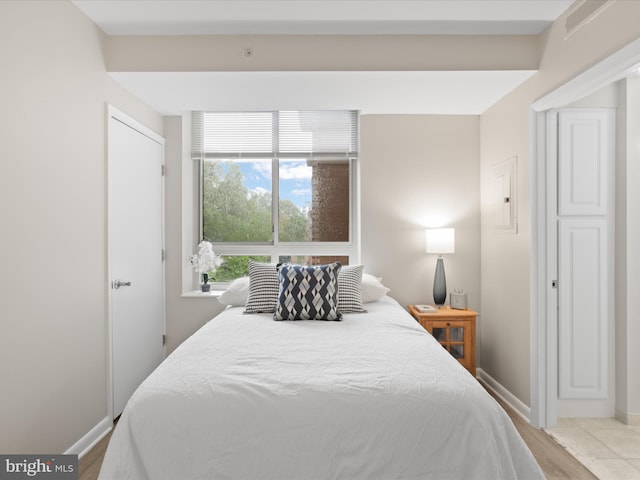350 G St SW Unit N407, Washington, DC 20024 - bedroom featuring baseboards and wood finished floors