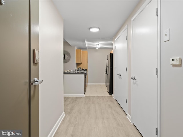 350 G St SW Unit N407, Washington, DC 20024 - corridor featuring baseboards and light wood-style floors