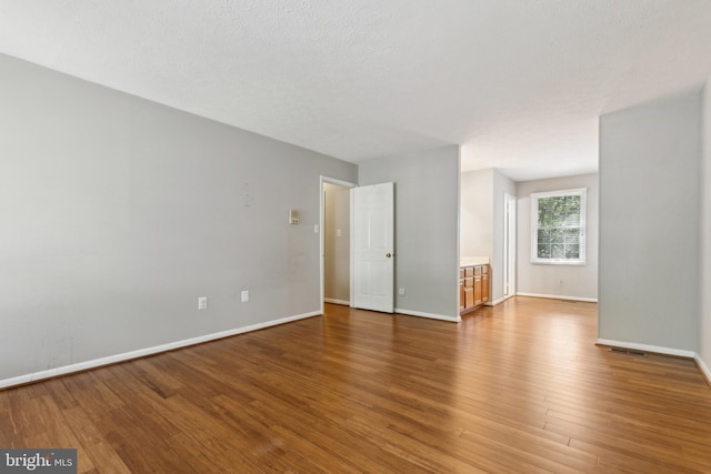 15915 Marlington Dr, Dumfries, VA 22025 - unfurnished room featuring wood finished floors and baseboards