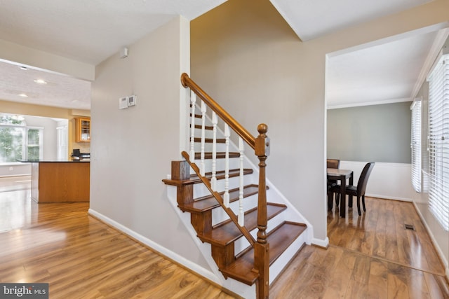 15915 Marlington Dr, Dumfries, VA 22025 - stairway with wood finished floors, baseboards, and recessed lighting