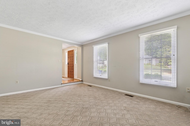 15915 Marlington Dr, Dumfries, VA 22025 - spare room featuring crown molding, a textured ceiling, baseboards, and carpet floors