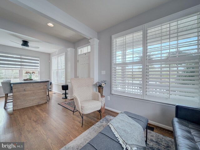 9477 Cromarty Ct, Bristow, VA 20136 - living area with decorative columns, wood finished floors, baseboards, ceiling fan, and recessed lighting