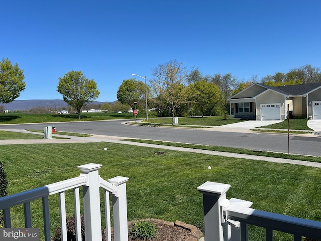 561 Great Oak Ct, Woodstock, VA 22664 - view of yard with an attached garage, driveway, and a mountain view