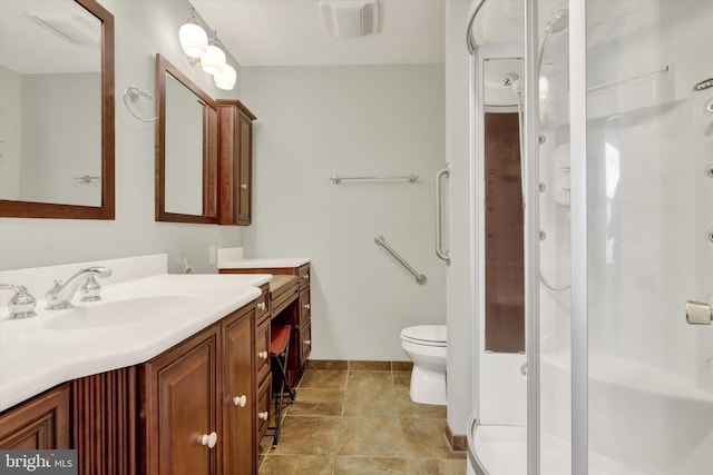 full bathroom featuring visible vents, toilet, vanity, baseboards, and a stall shower