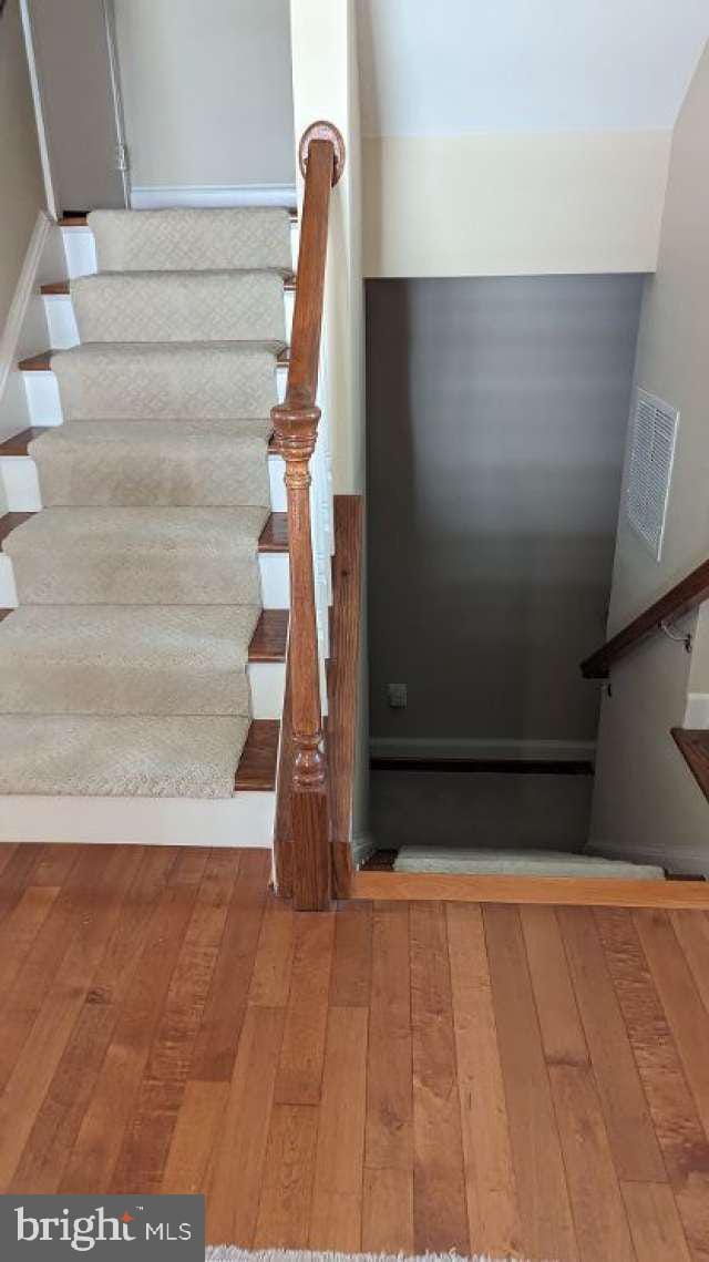 402 Village Center Blvd, Milton, DE 19968 - stairway with hardwood / wood-style floors and visible vents