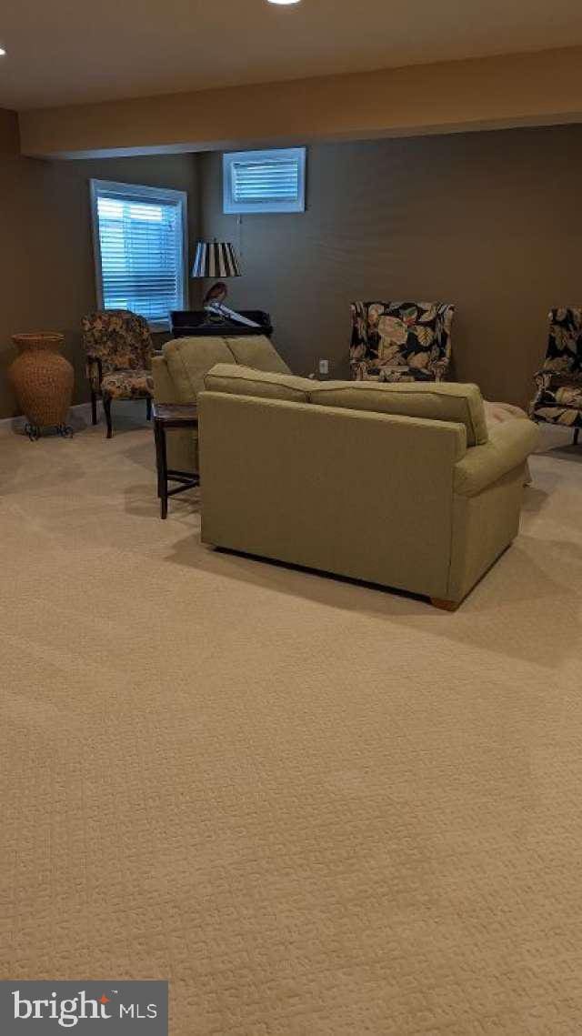 402 Village Center Blvd, Milton, DE 19968 - living room featuring light carpet and recessed lighting