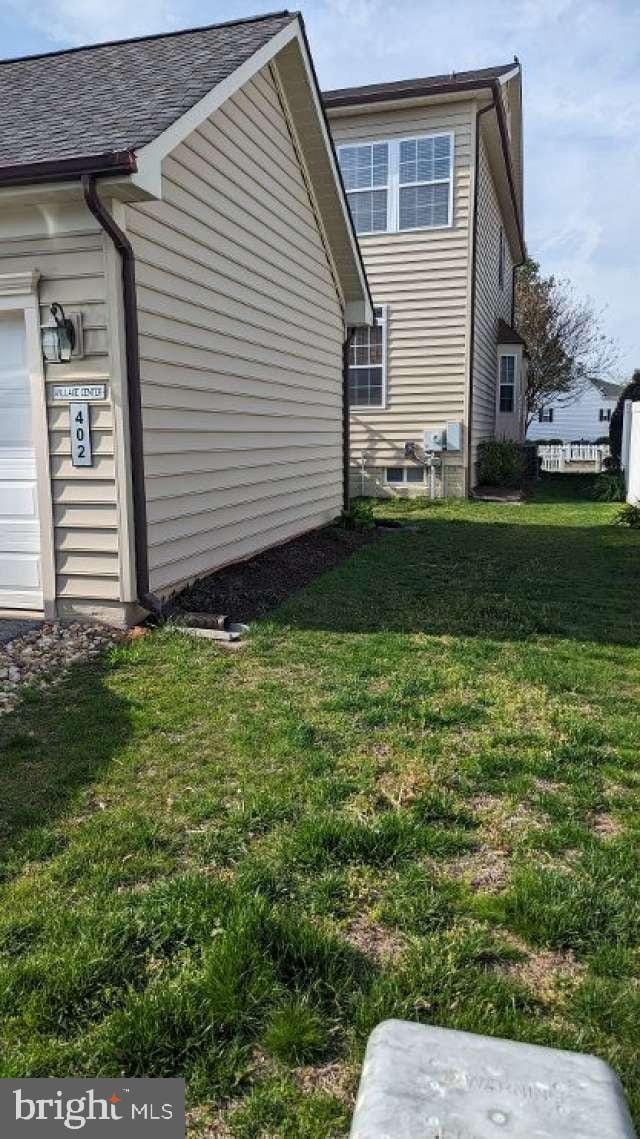 402 Village Center Blvd, Milton, DE 19968 - view of side of property featuring a yard