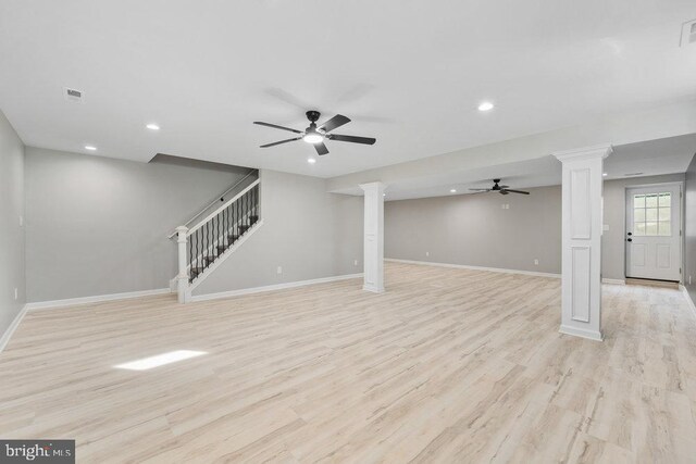 below grade area with ceiling fan, recessed lighting, light wood finished floors, baseboards, and stairs