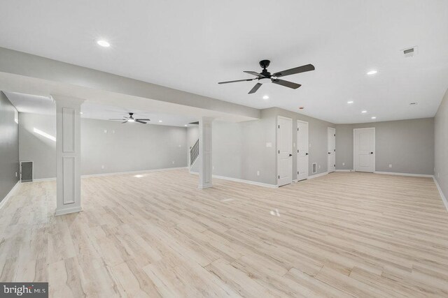 below grade area featuring recessed lighting, baseboards, ceiling fan, and light wood-type flooring