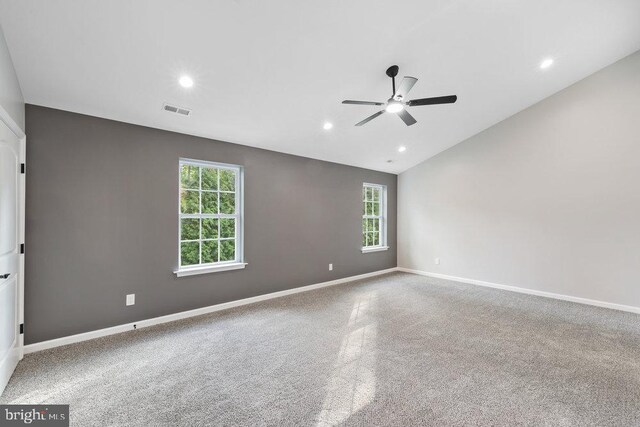 spare room with ceiling fan, lofted ceiling, baseboards, recessed lighting, and carpet