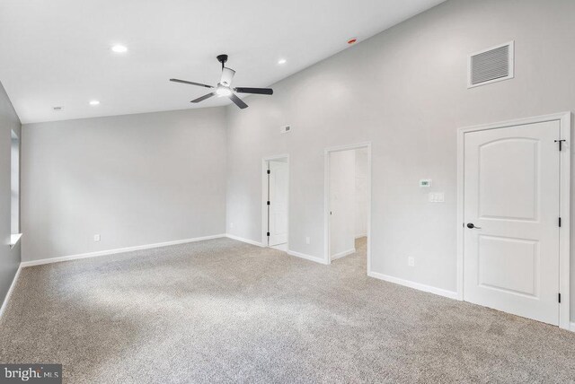 unfurnished living room featuring a ceiling fan, high vaulted ceiling, carpet floors, recessed lighting, and baseboards