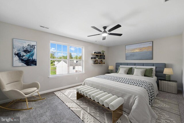 bedroom with carpet floors, baseboards, and ceiling fan