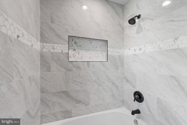 full bath featuring shower / bathtub combination