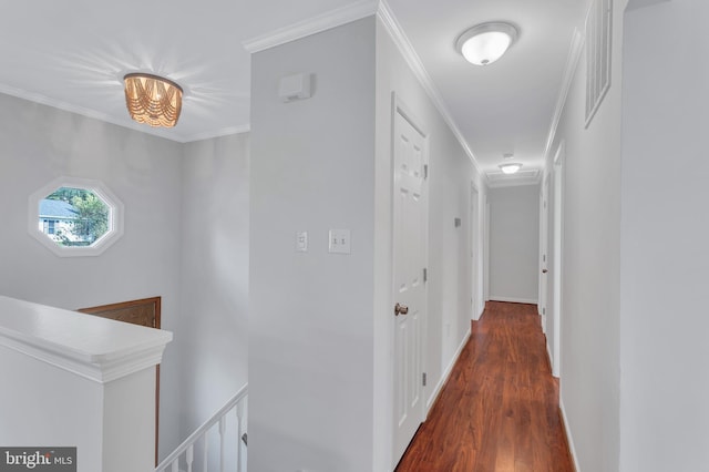corridor featuring crown molding, an upstairs landing, wood finished floors, and baseboards