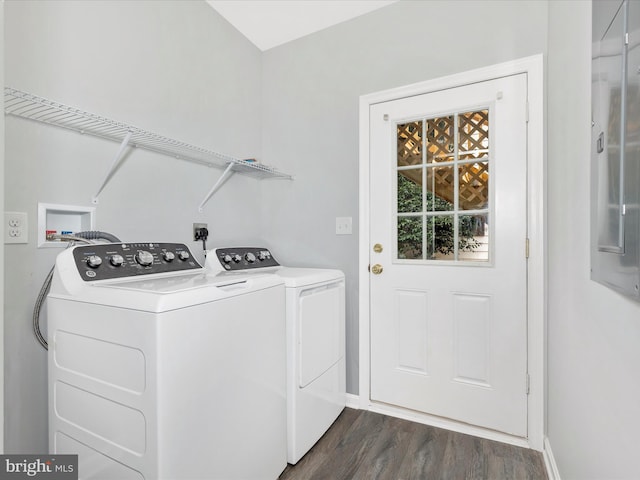 laundry area featuring washing machine and dryer, dark wood finished floors, baseboards, and laundry area