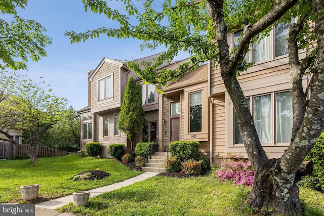 1070 Trevino Ln, Herndon, VA 20170 - view of front facade with a front lawn and fence