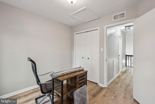 1070 Trevino Ln, Herndon, VA 20170 - office area featuring baseboards, visible vents, attic access, and light wood-type flooring