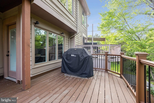 1070 Trevino Ln, Herndon, VA 20170 - wooden deck with a grill