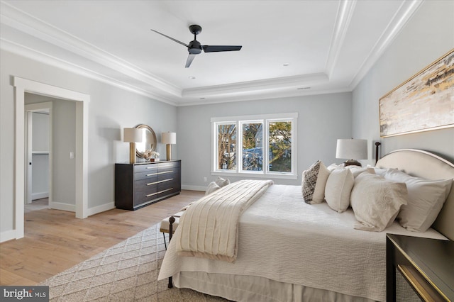 6221 Nelway Dr, Mclean, VA 22101 - bedroom with baseboards, ornamental molding, a tray ceiling, and light wood-style floors