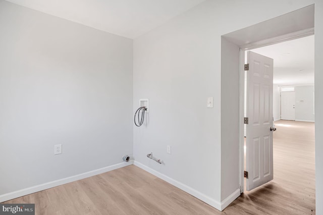 washroom with washer hookup, gas dryer hookup, laundry area, light wood-type flooring, and baseboards