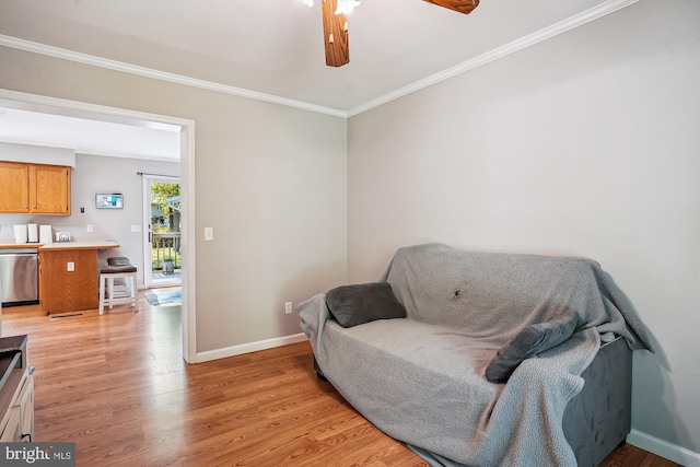 813 Petinot Pl, Stevensville, MD 21666 - living area with light wood-type flooring, a ceiling fan, ornamental molding, and baseboards