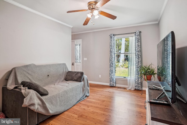 813 Petinot Pl, Stevensville, MD 21666 - living area featuring wood finished floors, ceiling fan, crown molding, and baseboards