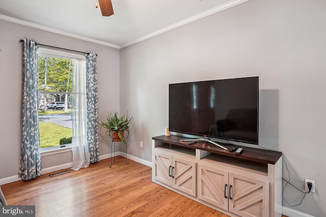 813 Petinot Pl, Stevensville, MD 21666 - living room with crown molding, light wood-style floors, baseboards, and ceiling fan