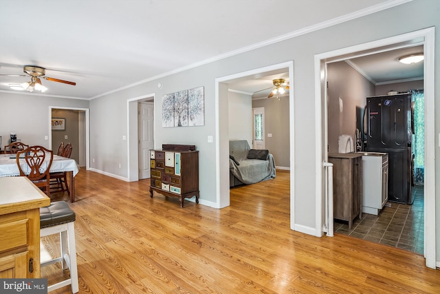 813 Petinot Pl, Stevensville, MD 21666 - hall featuring crown molding, light wood finished floors, and baseboards