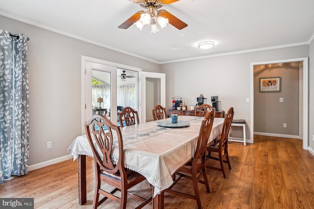 813 Petinot Pl, Stevensville, MD 21666 - dining room with light wood-style floors, ornamental molding, a ceiling fan, and baseboards