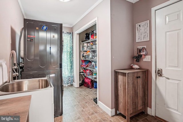 813 Petinot Pl, Stevensville, MD 21666 - washroom with stacked washer / drying machine, ornamental molding, and baseboards