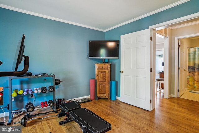 813 Petinot Pl, Stevensville, MD 21666 - exercise room with wood finished floors, ornamental molding, and baseboards