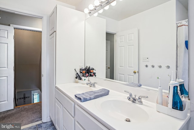813 Petinot Pl, Stevensville, MD 21666 - bathroom with double vanity and tile patterned flooring